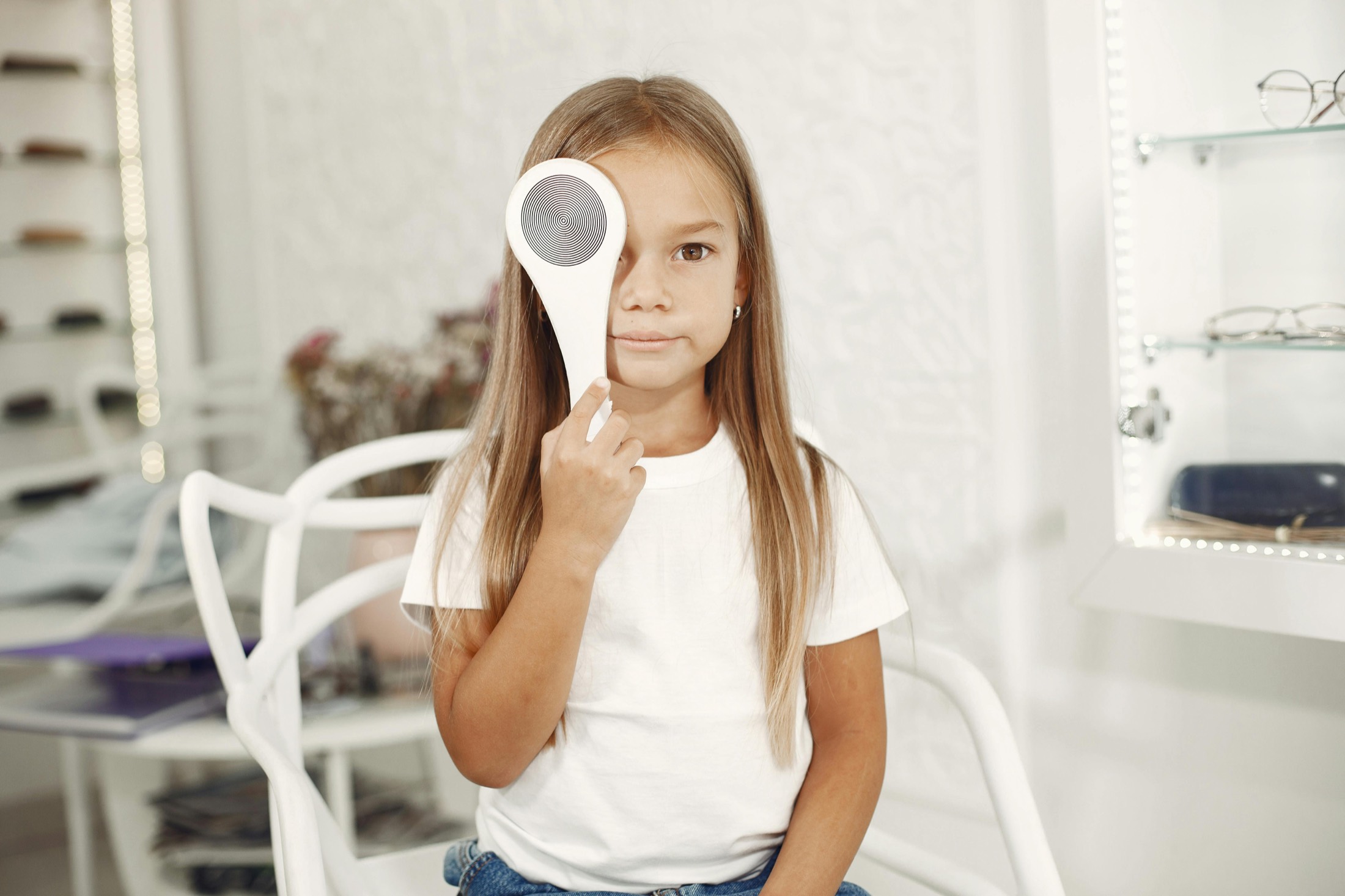 Child and parent during a vision examination at DUOS